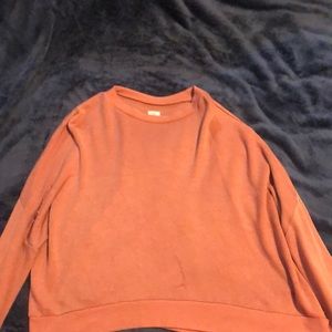 a salmon pink long sleeve